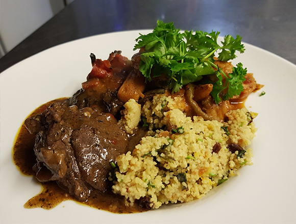 succulent beef dish served with spicy couscous and fresh herbs