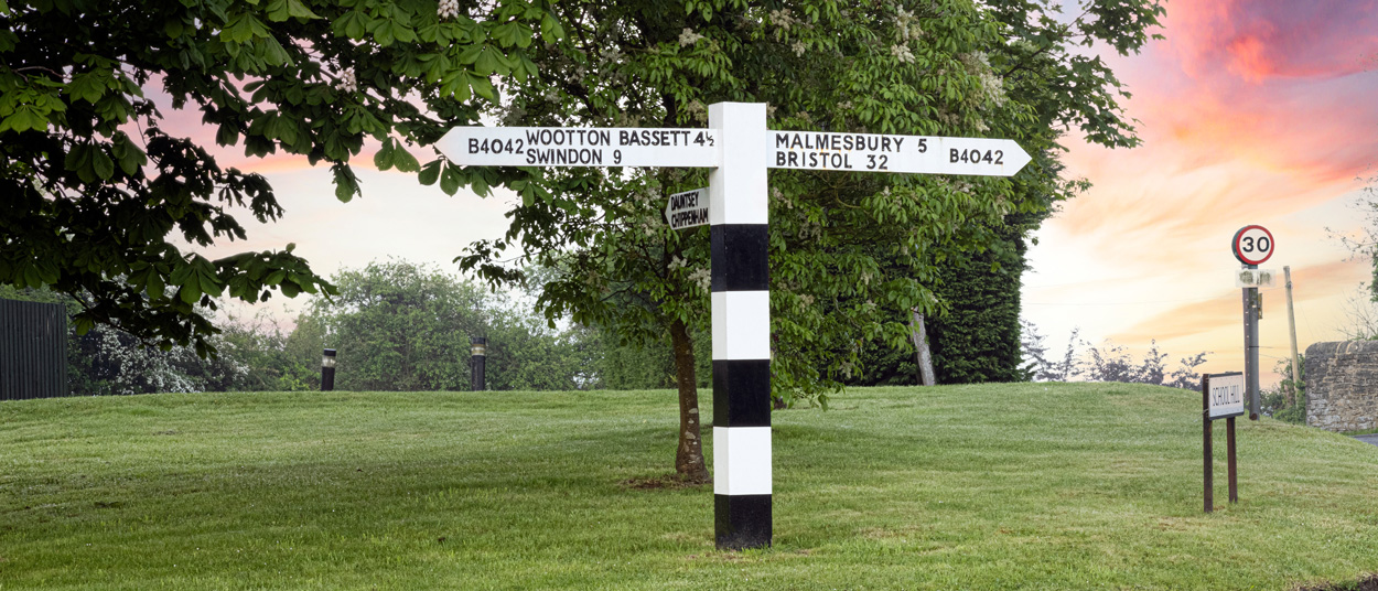 A signpost to royal wootton bassett and swindon